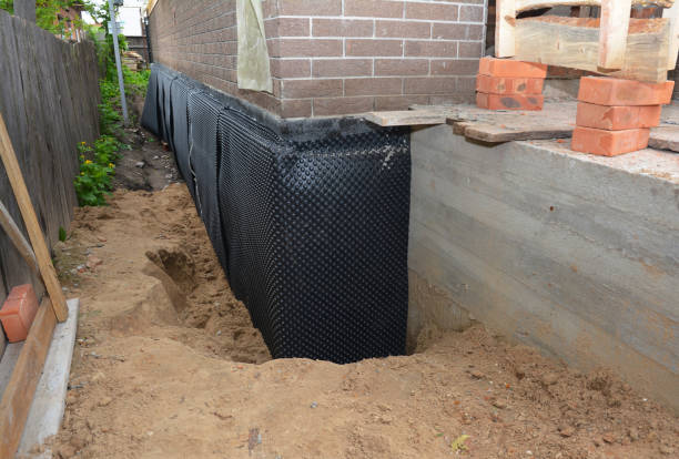 Happy homeowners after waterproofing job in New Boston